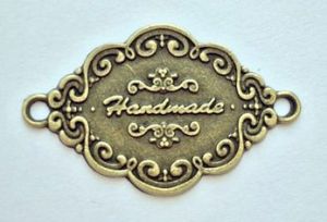 Филигрань 098, Бирка металлическая Hand Made, 40х25 мм, цвет: бронза ― Творча майстерня ДекоПарк