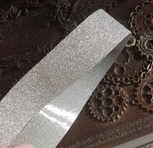 Лента 1-018, Серебро, на клеенке, 18мм, 1м пог ― Творча майстерня ДекоПарк